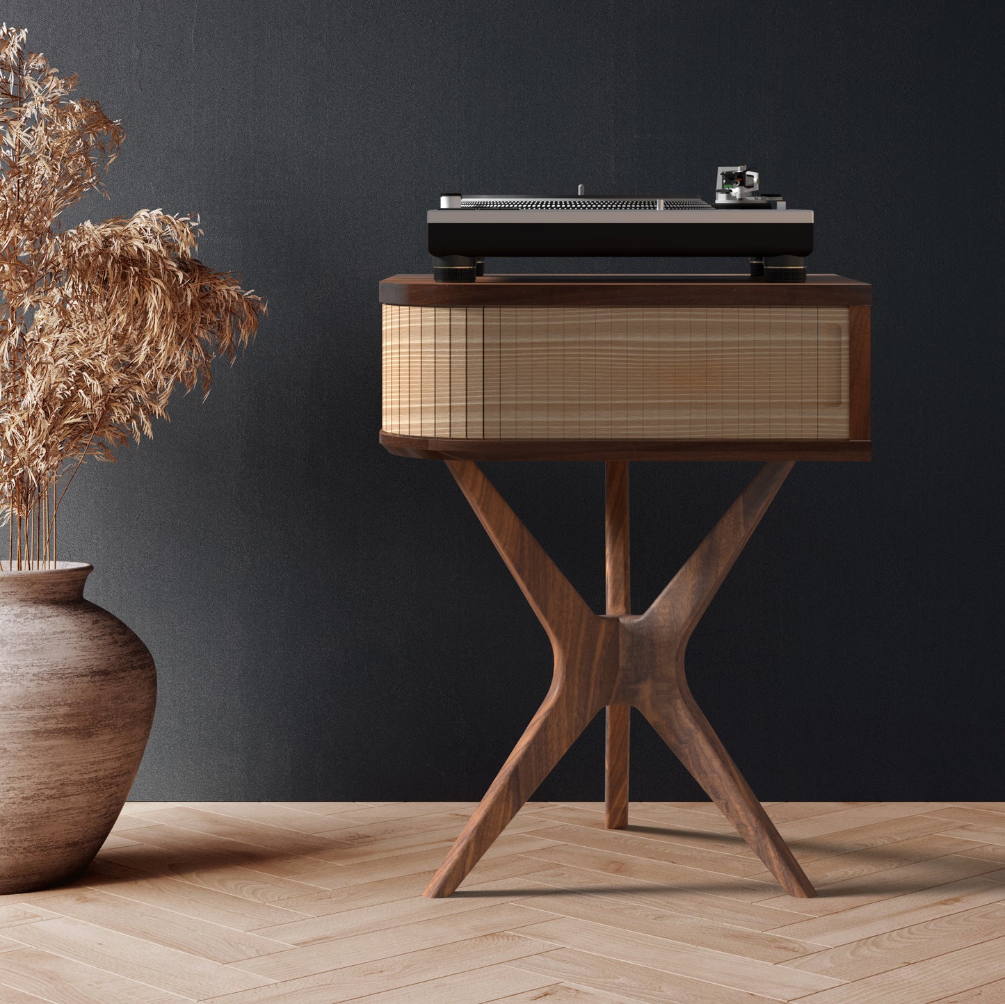A mid-century modern record player stand made of black walnut and white oak, with a turntable on top