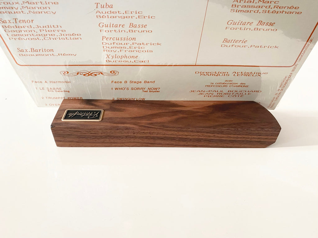 Front view of the walnut now playing stand with a record sleeve