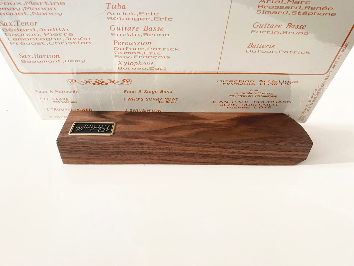 Front view of the walnut now playing stand with a record sleeve