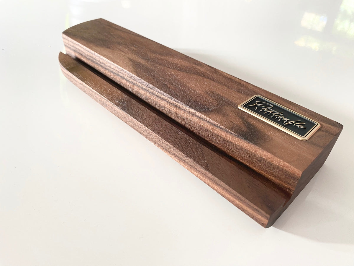 Groove and walnut grain of the now playing stand